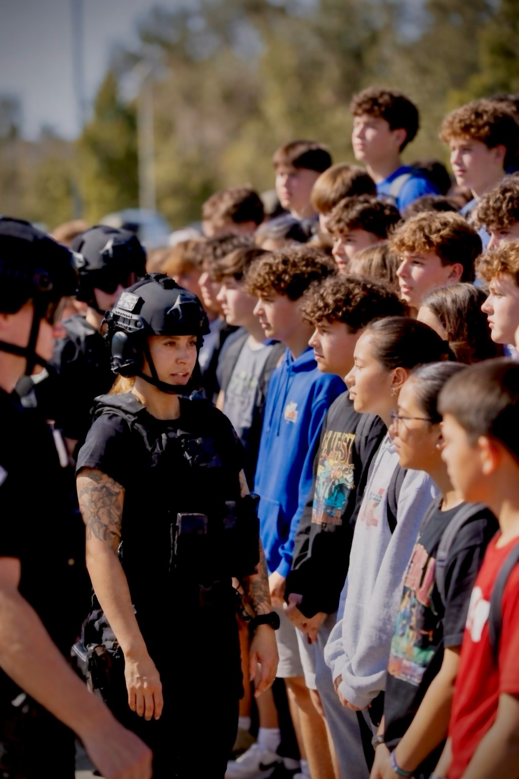 a group of students interact with the TAC program instructors